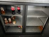 a refrigerator that has a lot of bottles and jars in it