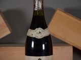 a bottle of wine that is sitting on a table