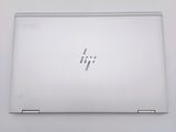 a white laptop that is sitting on a table