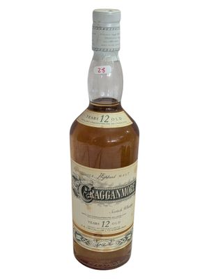 a bottle of whisky with a white label on it