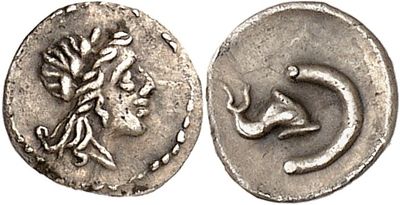 a silver coin with an image of a horse on it