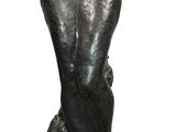statue of a woman holding a flower in her right hand