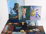many paintings that are on display on the table