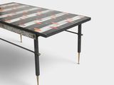 a black and white coffee table with a wooden top and metal legs