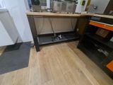 hardwood floor in a kitchen with a microwave and oven on it