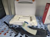 a white box with a black handle on a table