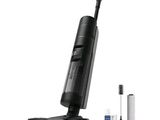 une image représentant un aspirateur noir muni d'une brosse et d'une brosse à dents