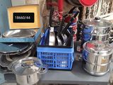 many pots and pans on a table in the kitchen