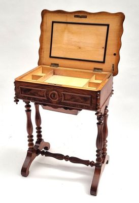 a small wooden table with a drawer on top of it
