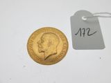 a close up of a gold coin with a price tag on it