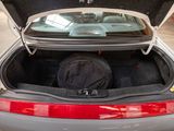 a trunk of a car with a bag in it