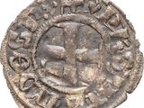 a close up of a coin with a cross on it