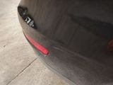 a close up of a car ' s tail light on the side of the car