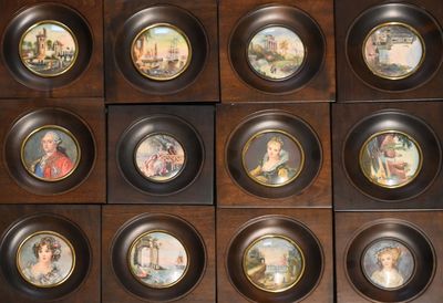 many plates with different pictures of people on them