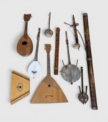 several different types of musical instruments are arranged on a white surface