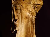 statue of a man with a hat on his head and a rope around his neck