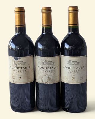 three bottles of wine sitting next to each other on a table