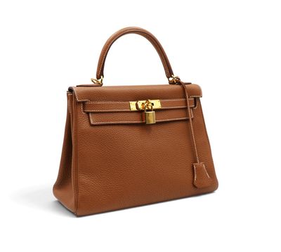 a brown leather handbag on a white background