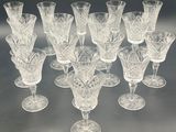 a lot of wine glasses that are sitting on a table