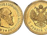 a gold coin with the image of a man and a bird on it