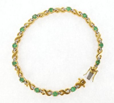 an emerald and diamond bracelet