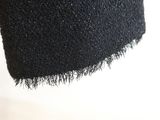 an image of a close up of a black skirt
