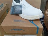 a box with a pair of white shoes on top of it