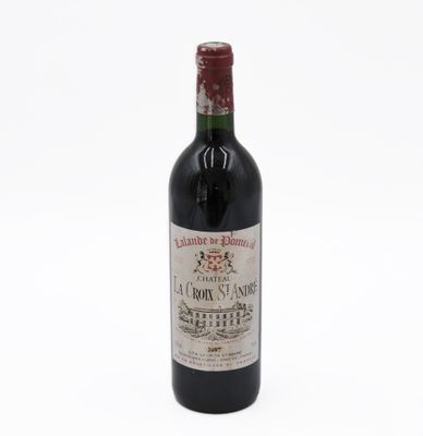 a bottle of wine that is sitting on a table