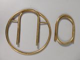 a picture of a gold brooch and a pair of earrings