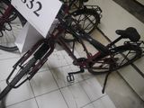 a bicycle that is sitting on the floor with a price tag attached to it