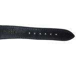 a close up of a black leather watch strap on a white background