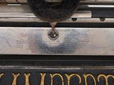 a close up of a typewriter with the words vanderbergs written on it
