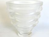 a glass vase that is sitting on a table