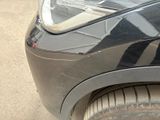 a close up of a car ' s headlight on the front of the car