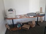 a desk with a printer on it in a room