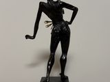 an image of a statue of a woman with a bird in her hand