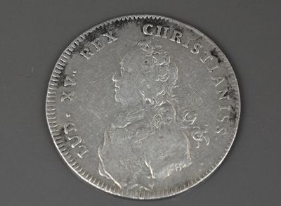 une pièce d'argent à l'effigie d'une femme