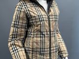 the mannequin is wearing a jacket and pants with a fur lined hood