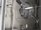 a machine that is inside of a building with the door open