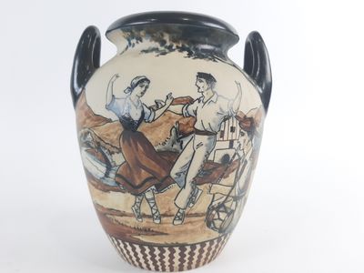 a vase with a picture of a man and a woman riding a horse