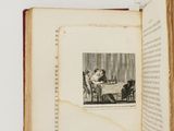 an open book with a picture of a family sitting at a table