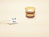 a gold ring with a price tag attached to it