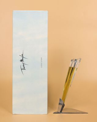 an image of a pen and a box with writing on it