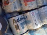 several cans of baby formulas are stacked on top of each other