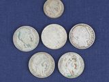 six pièces d'argent britanniques, dont un souverain, un souverain, un souverain et un souverain