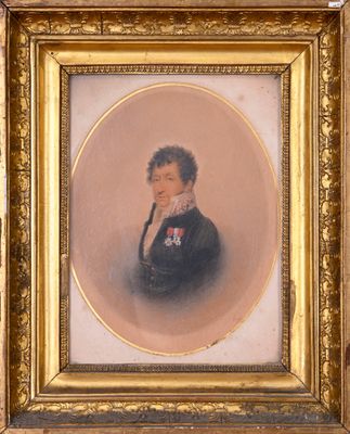 portrait of a gentleman in a black suit with a gold frame