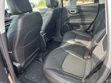 the back seats of a car are black and grey in color