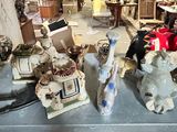 several figurines are sitting on top of a table in a store