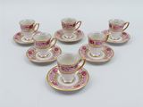 six cups and saucers with pink flowers on them