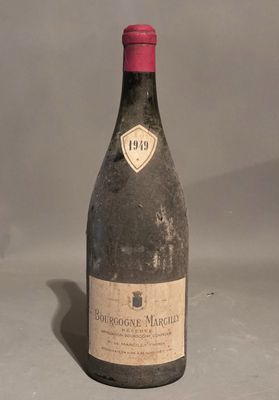 a bottle of wine that is sitting on a table
